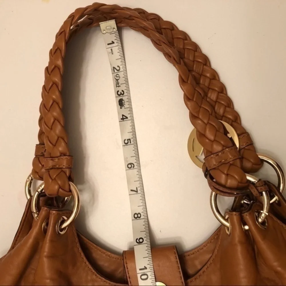 Michael kors brown leather grommet tassel bag